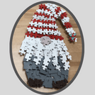 Photo of a gnome made out of puzzle pieces